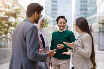 Poster - Multi-ethnic group of young business people outdoors in the city
