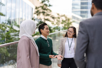 Wall Mural - Multi-ethnic group of young business people outdoors in the city
