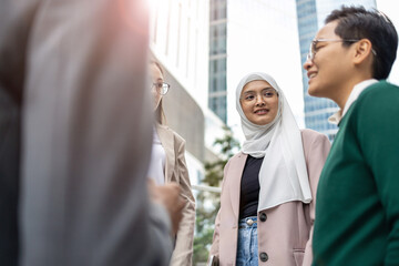 Poster - Multi-ethnic group of young business people outdoors in the city
