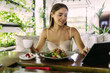 © F8  \ Suport Ukraine - Beautiful young businesswoman in the cafe, using digital tablet and have lunch