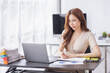 © David - Portrait of Young Asian businesswoman is happy to work at the modern office using a laptop computer, freelance business employee online marketing e-commerce telemarketing concept.