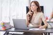 © David - Portrait of Young Asian businesswoman is happy to work at the modern office using a laptop computer, freelance business employee online marketing e-commerce telemarketing concept.