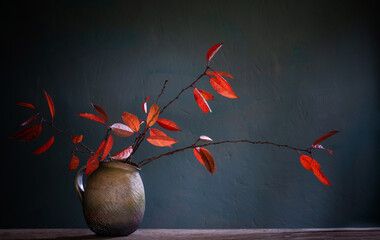 Wall Mural - red autumn leaves in ceramic jug on old wooden table