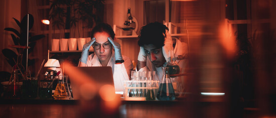 A microscope is being utilized for study in the lab by a group of scientists who are doing rigorous investigation.