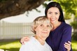 © BillionPhotos.com - Adult woman with her senior mother in park