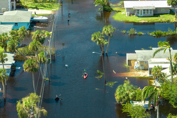Wall Mural - Hurricane Ian flooded houses in Florida residential area. Natural disaster and its consequences