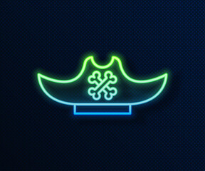 Poster - Glowing neon line Pirate hat icon isolated on blue background. Vector