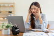 © Katcha - Female freelance is feeling stressful and headache from thinking the strategy plan of the business