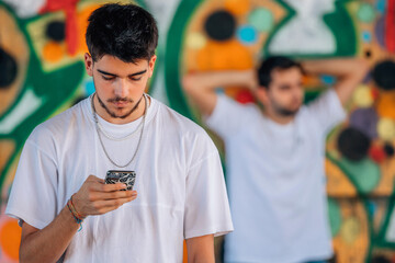 Poster - urban youth with mobile phone in the street