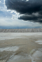 Natural Salt Flats. Industry And Open Cast Mining. Saltworks And Salt Natural Fields Under A Dramatic And Stormy Sky.