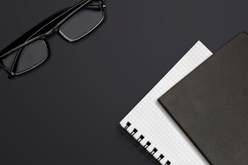 Wall Mural - Glasses, books and notebooks on office desk