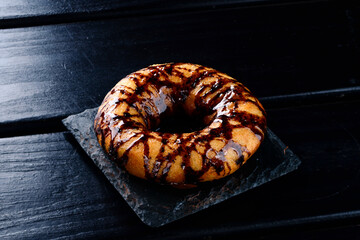 Wall Mural - donut with chocolate sauce close up