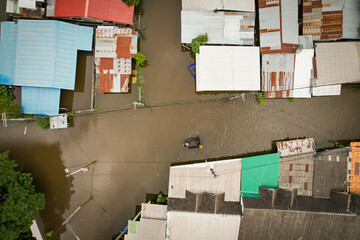 Wall Mural - High-angle view of the Great Flood, Meng District, Thailand, on October 3, 2022, is a photograph from real flooding. With a slight color adjustment
