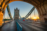 Fototapeta Miasto - Tower Bridge with sunrise flare in London. England