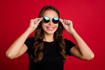 Sticker - Photo of young charming woman good mood wear eyeglasses trip vacation isolated over red color background