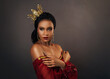 © kharchenkoirina - Fantasy happy beauty portrait african american woman goddess queen. Gold luxury art royal professional makeup golden crown. Girl princess pretty face perfect skin. Red lips sexy eyes vintage dress