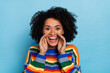 Photo of hooray curly hairdo lady tell secret wear vivid sweater isolated on blue color background