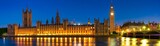 Fototapeta Londyn - Night time panorama of Big Ben and Westminster in London. England