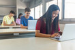 © EFStock - Asian female teenage Student working with laptop at school