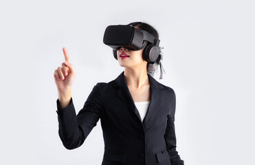 Young asian business woman in black suit wearing vr goggles headset posing finger pointing and touching on white background. Metaverse concept.