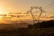 © yaqui_villegas - High voltage cables with the sky at sunset in the background