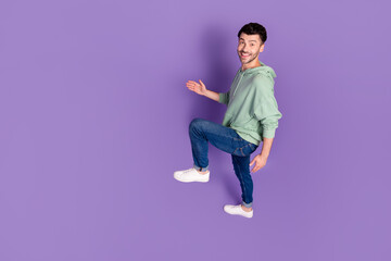 Poster - Full size above view photo of satisfied glad person walk climb empty space stairs isolated on purple color background