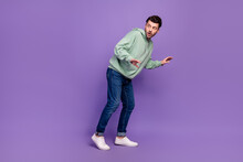 Full Length Side Photo Of Nervous Funny Man Look Empty Space Walk Silent Robbery Dont Want Wake Up Owners Isolated On Pastel Violet Color Background