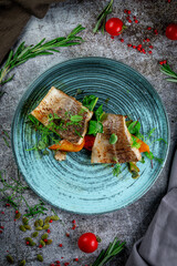 Canvas Print - Fried pikeperch with vegetables and herbs