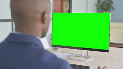 Young African Businessman Working on Computer with Green Screen