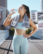 © Siphosethu F/peopleimages.com - Woman with water bottle, and fitness in the city, rest and drinking with towel on summer morning in Australia. Health, exercise and girl runner taking time for resting during outdoor urban workout.