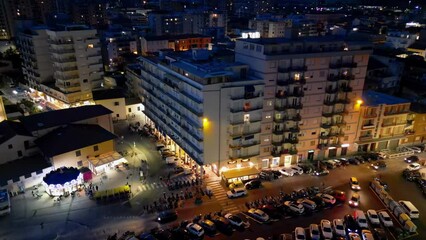 Sticker - Aerial view of city streets and buildings along the ocean from drone viewpoint