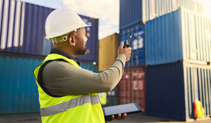 Logistics, supply chain and shipping with a man, tablet and radio to plan delivery and shipment of container. Stock, cargo and freight worker on a commercial dock for export and import distribution