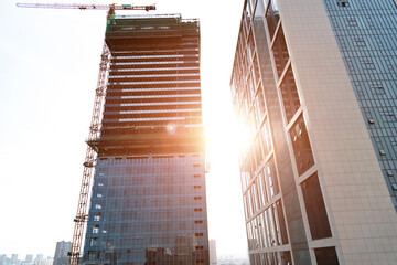 Canvas Print - New building with crane under construction