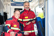 © zinkevych - Paramedical staff posing for the camera in the ambulance car