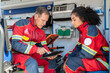 © zinkevych - Two paramedics sitting in the ambulance car