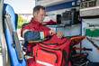 © zinkevych - Focused serious paramedical professional preparing for a medical emergency call
