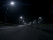 © pavelkant - thick night fog on a lighted highway . dangerous road conditions