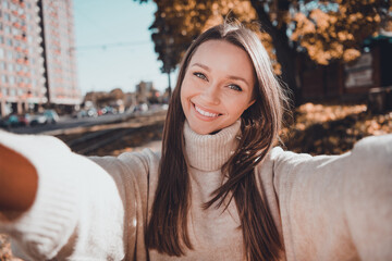 Sticker - Portrait of lovely sweet millennial lady girlfriend wear stylish sweater take photo town building walk street sunshine cool day outdoors