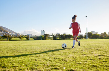 Wall Mural - Girl running on grass field, soccer fitness to kick football and young kid training energy in Brazil. Strong healthy child, future athlete exercise for goal and play outdoor sports game happiness