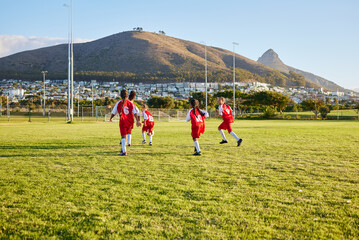 Wall Mural - Girls, soccer team or fitness game on grass field in workout, training or exercise for game or match goals. Running, football or sports children, students or kids in energy competition at high school