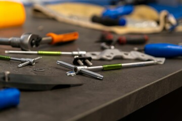 Variety of bikeshop tools on the table, close-up