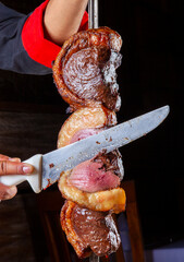 Canvas Print - Steak rotisserie at the steakhouse, sliced picanha, Picanha