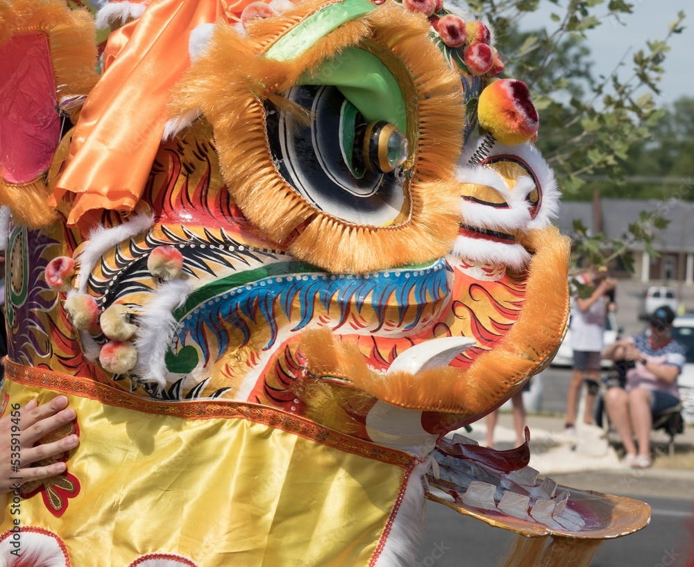 Closeup of Chinese dragon mascots in the streets of Carmel Indiana for