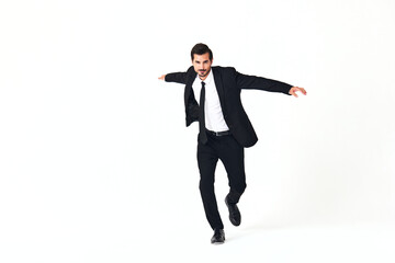 Man business smile with teeth in costume running and jumping up open mouth happiness and surprise full-length on white isolated background copy place 