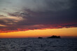 Sea panorama with a view of a small island and a ship. Sunset by the sea. Adriatic Sea