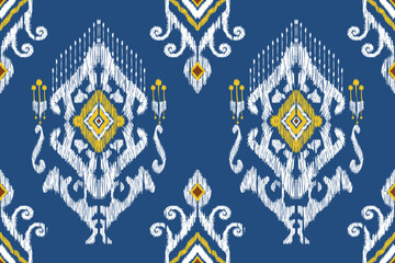 Ikat paisley embroidery on blue background.geometric ethnic oriental seamless pattern traditional.Aztec style abstract vector illustration.design for texture,fabric,clothing,wrapping,decoration,carpet