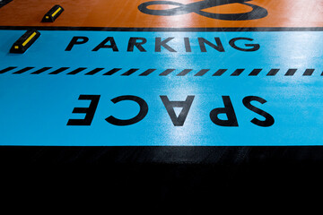 Wall Mural - Word parking space on parking garage floor