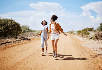 Energy, friends and travel with women walking on a dirt road, explore nature and freedom. Adventure, vacation and black women having fun and bonding in Mexico, carefree and cheerful and enjoying trip