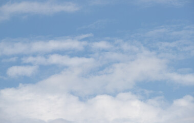 Blue sky with white clouds. Sky background.