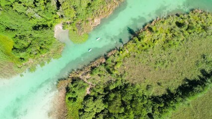 Wall Mural - Klagenfurt, Austria. Aerial view of creek and lake in summer season